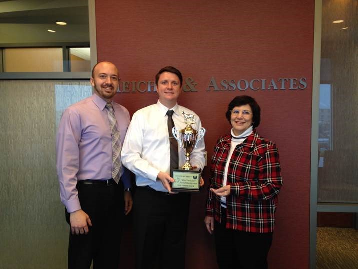 David Meicher receiving an award for the annual "Kiss the Goat" Fundraiser sponsored by REACH-A-Child.